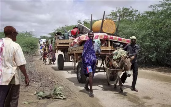 Civilians with a donkey cart laden with their belongings flee from a district in northern Mogadishu, Somalia. Kenya's military spokesman Maj. Emmanuel Chirchir is using Twitter to warn people not to help&nbsp;al Shabab militants in Somalia by selling donkeys to them.